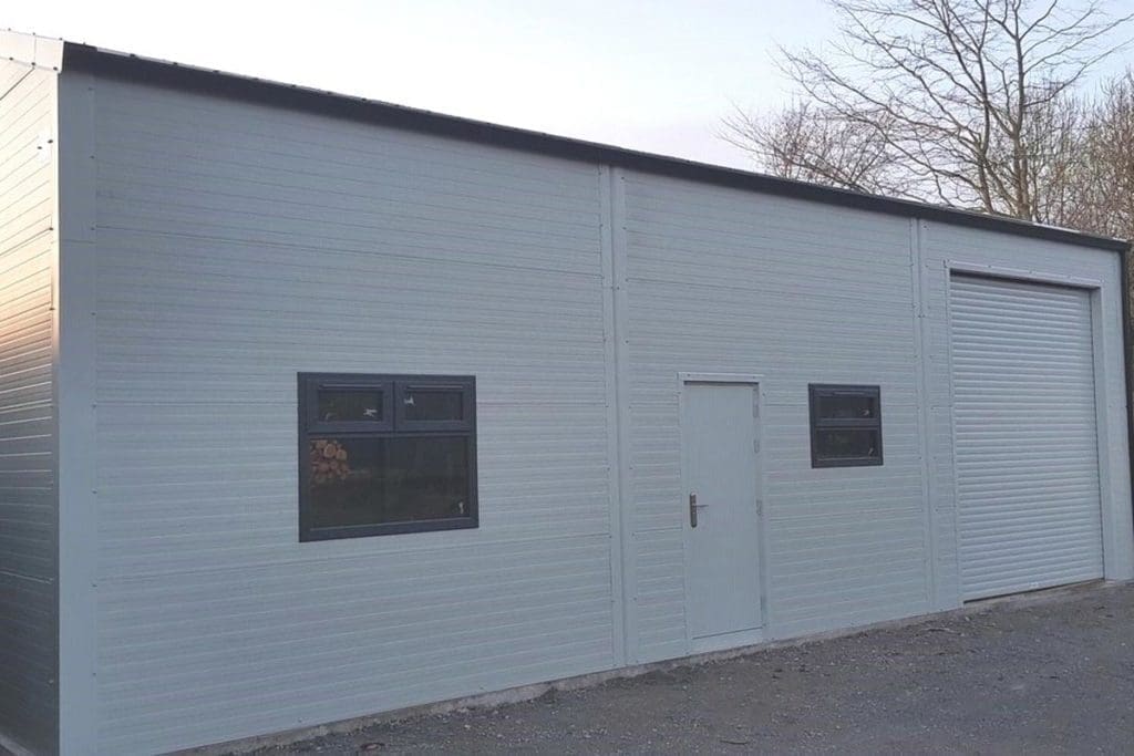 12.2m x 7m Gold Range unit with Goosewing Grey flat panel, roller on side