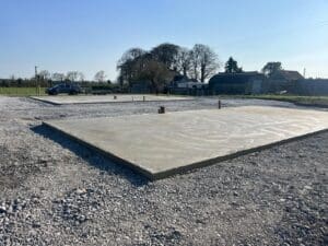 Concrete base with overhang method for Shanette insulated steel shed