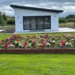 Exterior view of insulated steel chalets converted into holiday lets