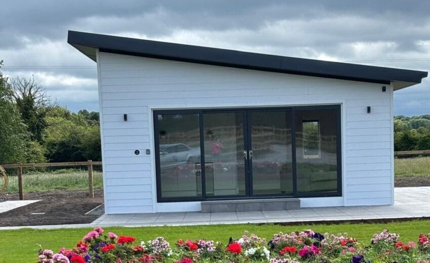 Insulated steel garden chalet in Kildare overclad with white kerrafront cladding